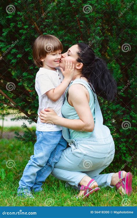 mother and son kiss|A Mother Holding and Kissing her Son